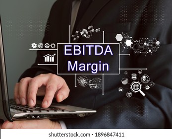 Business concept meaning EBITDA Margin with sign on the piece of paper.