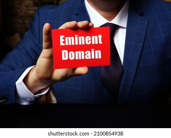 Business concept meaning Eminent Domain with sign on blank card in hand. - Shutterstock ID 2100854938