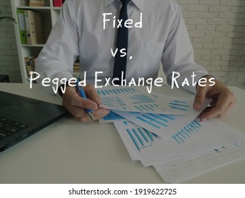 Business Concept Meaning Fixed Vs. Pegged Exchange Rates With Sign On The Piece Of Paper.
