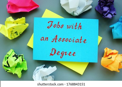 Business Concept Meaning Jobs With An Associate Degree With Sign On The Piece Of Paper.