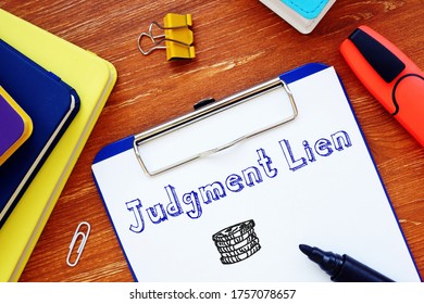 Business Concept Meaning Judgment Lien With Inscription On The Piece Of Paper.