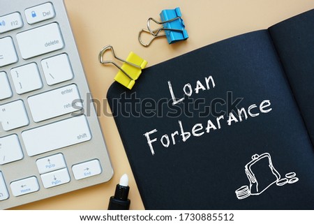 Business concept meaning Loan In Forbearance with sign on the page.