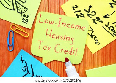 Business concept meaning Low-Income Housing Tax Credit with sign on the page.