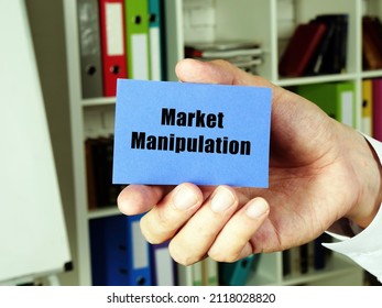 Business Concept Meaning Market Manipulation With Inscription On The Blue Business Card.
