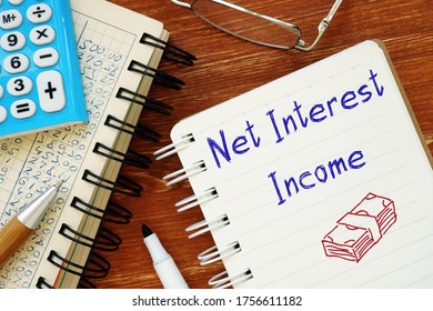 Business Concept Meaning Net Interest Income With Sign On The Sheet.