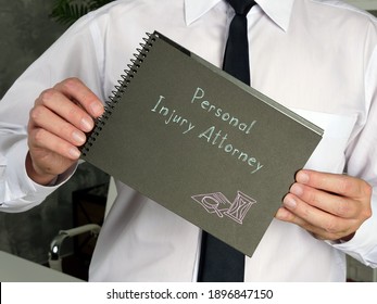 Business Concept Meaning Personal Injury Attorney With Inscription On The Piece Of Paper.
