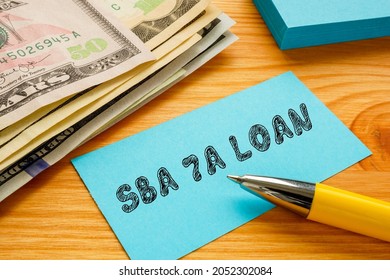 Business Concept Meaning SBA 7A LOAN With Sign On The Page. 
