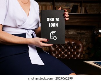 Business Concept Meaning Small Business Administration SBA 7A LOAN With Sign On Blank Card In Hand. 
