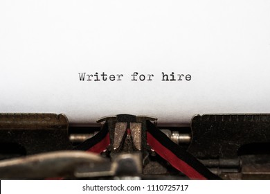 Business Concept, Message Writer For Hire Typed By A Vintage Typewriter On White Paper. Red And Black Ribbon Is Visible On The Machine. Concepts Of Journalism, Author, Copywriter, Tradition, Honesty