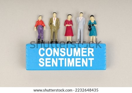 Business concept. On the blue block the inscription - Consumer Sentiment. There are figures of people on the block.