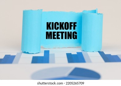 Business Concept. On The Blue Diagram And Graphs There Is A Twisted Paper Plate With The Inscription - Kickoff Meeting