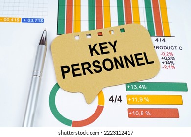 Business Concept. On The Business Charts Is A Pen And A Sign With The Inscription - Key Personnel