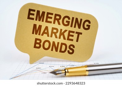 Business concept. On the business diagram is a pen and a sign with the inscription - emerging market bonds - Shutterstock ID 2293648323