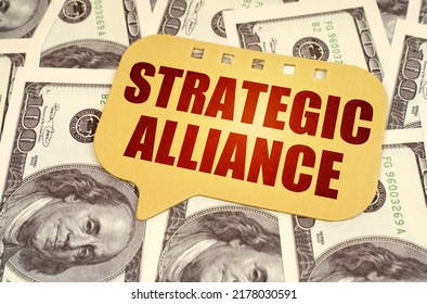 Business concept. On the dollars is a sign with the inscription - strategic alliance