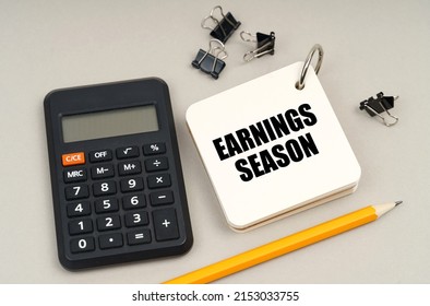 Business Concept. On A Gray Surface, A Calculator, A Pencil And A Notepad With The Inscription - Earnings Season