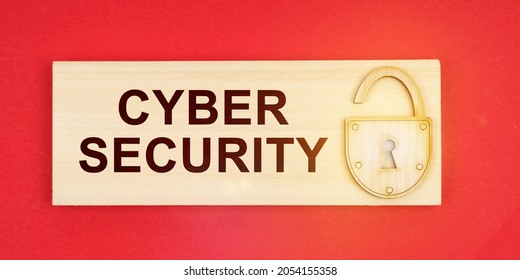 Business Concept. On A Red Background There Is A Small Plaque On It With A Lock And An Inscription -CYBER SECURITY