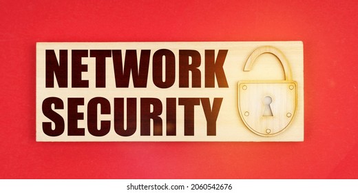 Business Concept. On A Red Background There Is A Small Plaque On It With A Lock And An Inscription - Network Security