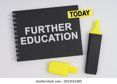 Business Concept. On A White Background Lies A Marker And A Notebook With A TODAY Sticker And The Inscription - FURTHER EDUCATION