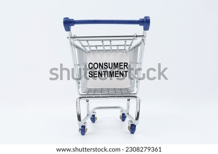 Business concept. On a white background is a shopping cart with a sign that says - Consumer Sentiment
