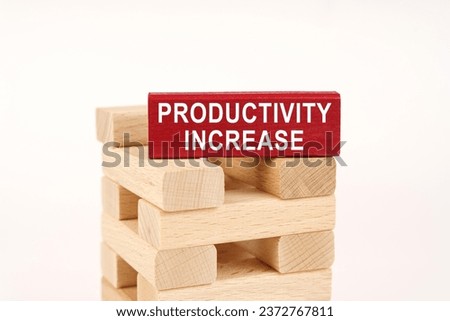 Business concept. On the wooden planks there is a red one with the inscription - Productivity Increase