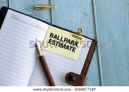 Business concept. open notepad with text on calendar - BALLPARK ESTIMATE.