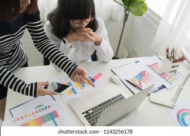 Business concept. Business people discussing the charts and graphs showing the results of their successful teamwork.  - Shutterstock ID 1143256178