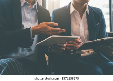 Business concept. Business people discussing the charts and graphs showing the results of their successful teamwork. - Shutterstock ID 1376259275