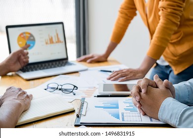 Business concept. Business people discussing the charts and graphs showing the results of their successful teamwork. - Shutterstock ID 1496831915
