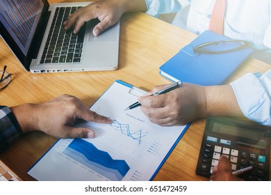 Business concept. Business people discussing the charts and graphs showing the results of their successful teamwork
 - Shutterstock ID 651472459