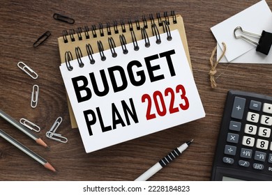 Business concept of planning 2023. top view of work desk and text on open notepad. New year business plan concept in 2023. Economy and business. BUDGET PLAN 2023 - Shutterstock ID 2228184823