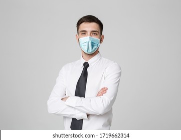 Business Concept - Portrait Handsome Businessman in face mask holding hands with confident face. White Background. - Powered by Shutterstock