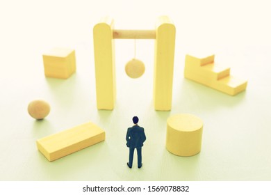 Business concept of problem solving and learning strategy. A businessman faces a challenge that needs to be solved in the most efficient way