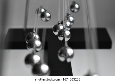 Business Concept For Strategy Team Work And Alignment. Newtons Cradle Pendulum.