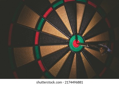 Business concept - Target and goal as concept. Dart arrow hit on bulleyes of dartboard to represent that the business reached the target