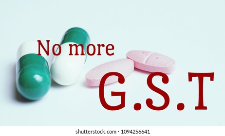 Business Concept. Text 'No More GST' On Pills And Capsule Background.