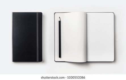 Business Concept - Top View Collection Of Black Hardcover Notebook, White Open & Flip Curl Rolled Page And Black Pencil Isolated On Background For Mockup