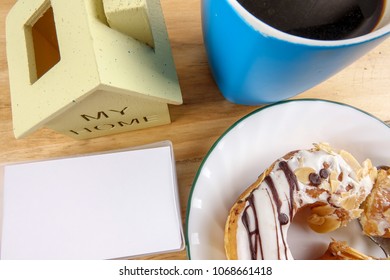 Business concept - Top view donut,notebook , pen, coffee cup, and phone on wood table. - Shutterstock ID 1068661418