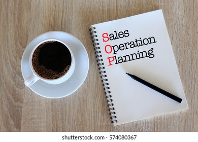 Business Concept - Top View Notebook Writing Sales Operation Planning