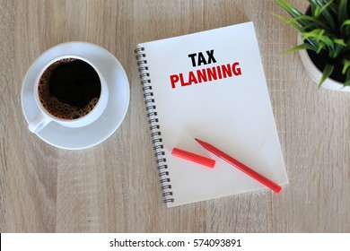 Business Concept - Top View Notebook Writing Tax Planning