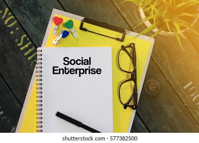 Business Concept - Top View Notebook Writing Social Enterprise
