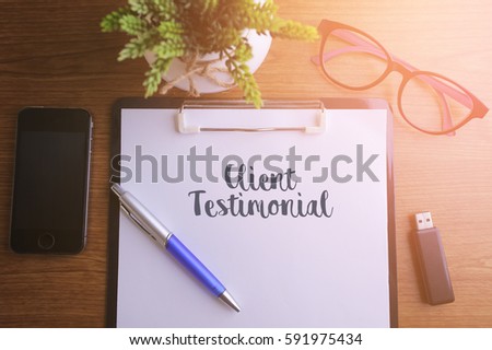 Business concept - Top view notebook writing Client Testimonial