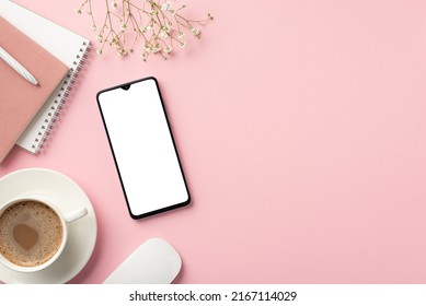 Business concept. Top view photo of workspace smartphone planners pen cup of coffee on saucer computer mouse and white gypsophila flowers on isolated pastel pink background with blank space