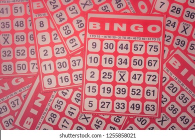 Business Concept : Top View Pile Of Empty Red Bingo Card Sheet. (Selective Focus)