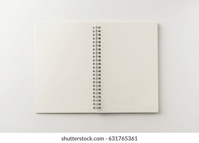 Business Concept - Top View Of Spiral Blank Notebook On White Background Desk For Mockup