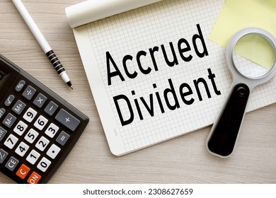 Business concept. top view of the text. wooden background. text - ACCRUED DIVIDEND - Shutterstock ID 2308627659