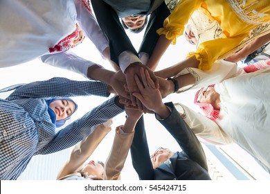 Business Concept: Young Business Man And Woman From Many Country Hand Shake Viewed From Below.
