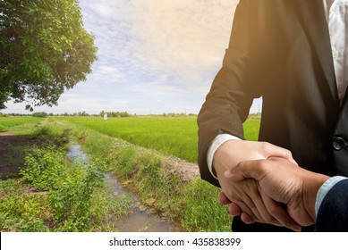 Business concept.Business handshake land purchase