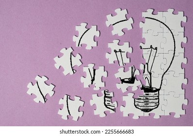 Business concept,innovation,ideas Personal development, human resources,recruitment,team building with jigsaw puzzle pieces and lightbulb