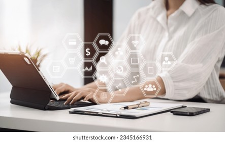 Business concepts, business women working in the work area with laptop and smartphone, data sheets at the desk. - Shutterstock ID 2345166931