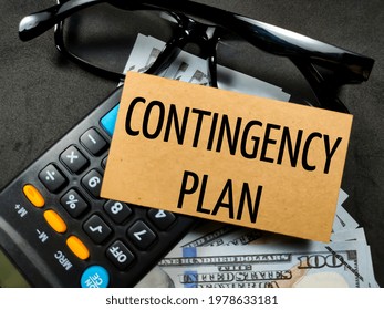 Business concept.Text CONTINGENCY PLAN with banknote,calculator and glasses on black background. - Shutterstock ID 1978633181
